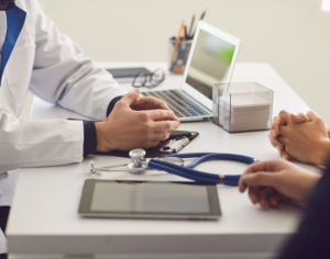 Doctor and patient sat together